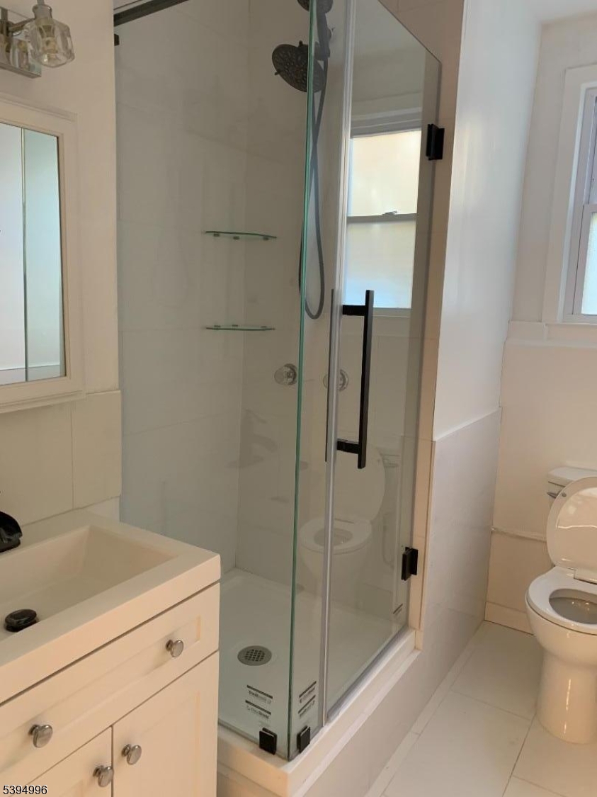 1072 Springfield Avenue New Providence, NJ 07974 - Photo 12 of 20 a bathroom with a shower and toilet