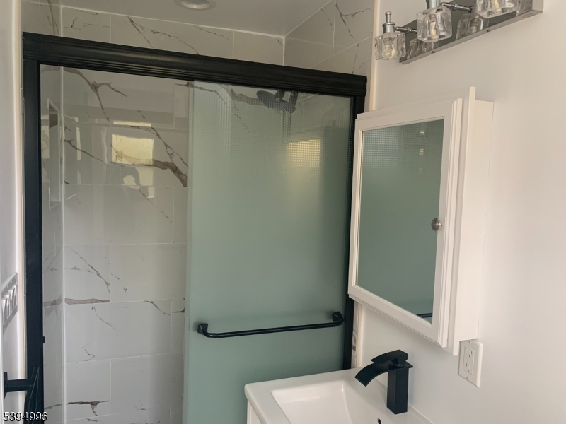 1072 Springfield Avenue New Providence, NJ 07974 - Photo 14 of 20 a bathroom with a shower