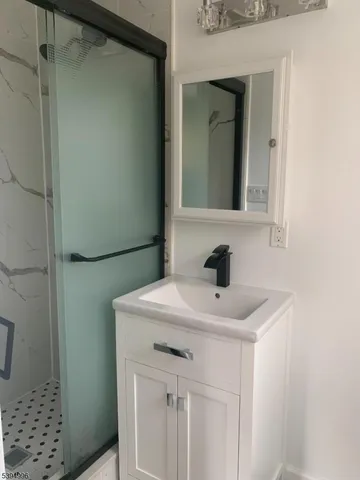 a bathroom with a sink a vanity and a mirror