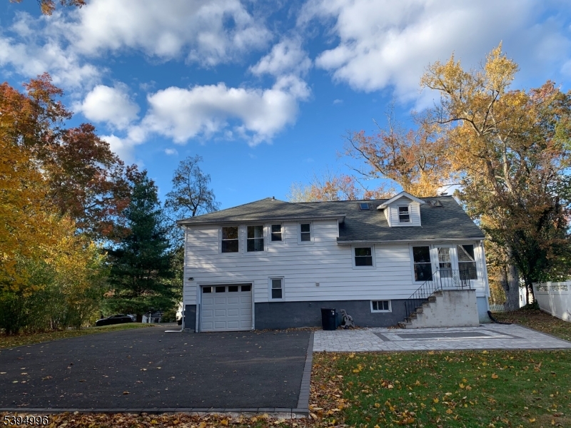 1072 Springfield Avenue New Providence, NJ 07974 - Photo 19 of 20 a front view of a house with garden