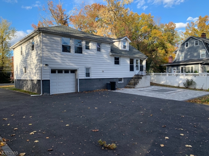 1072 Springfield Avenue New Providence, NJ 07974 - Photo 20 of 20 a front view of a house with a yard