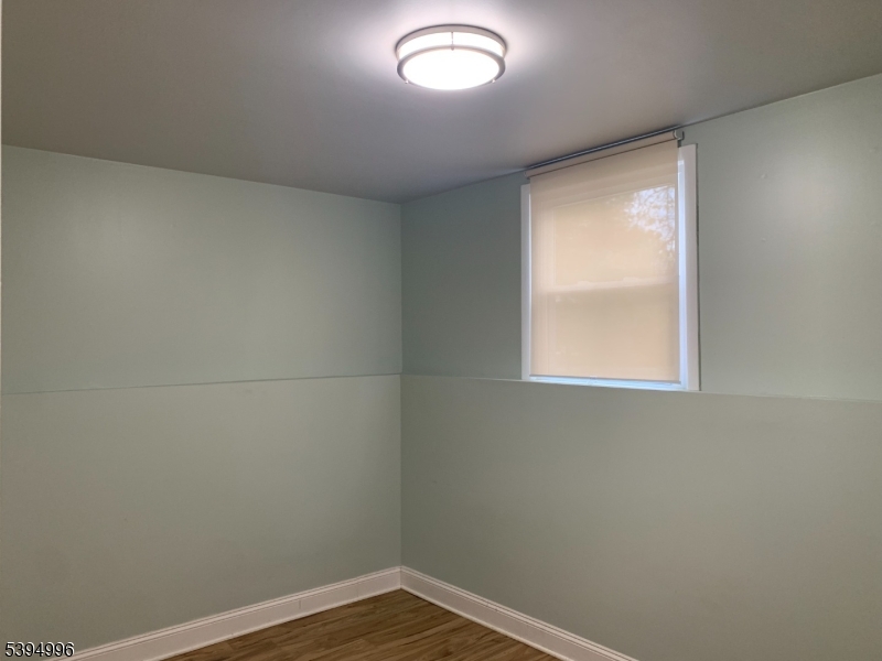 1072 Springfield Avenue New Providence, NJ 07974 - Photo 10 of 20 a view of a small space with wooden floor and a window
