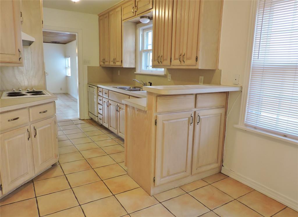 3425 Westcliff Road South Fort Worth, TX 76109 - Photo 6 of 22 Kitchen with light brown cabinetry and light tile patterned floors
