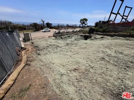 a view of a backyard with sitting area