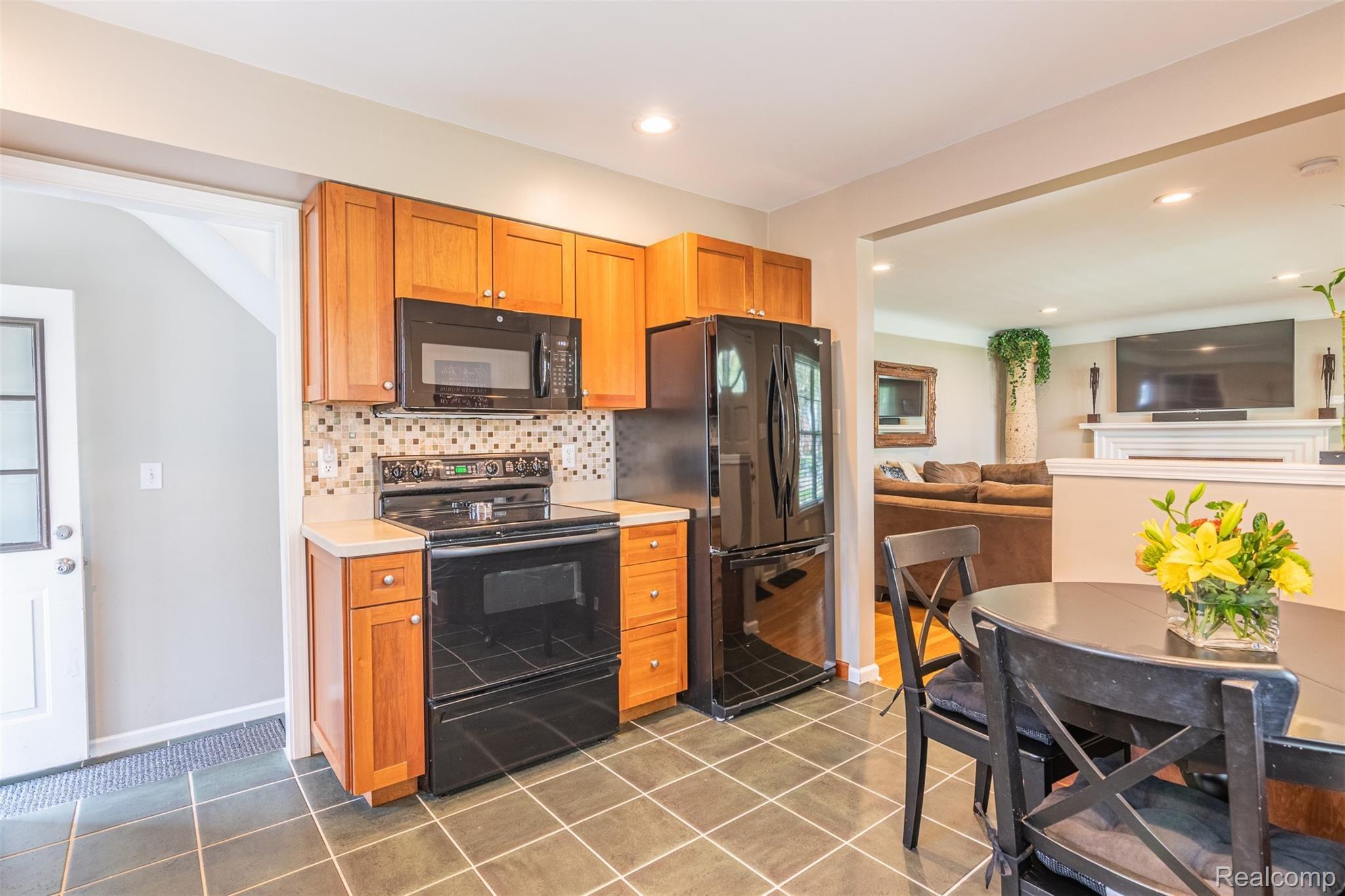 2023 Rosemont Road Berkley, MI 48072 - Photo 11 of 43 Kitchen with backsplash tile, includes appliances