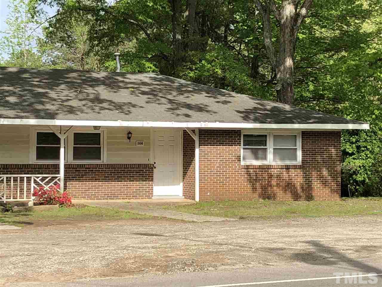 200 Jones Franklin Road Raleigh, NC 27606 - Photo 6 of 6 a view of a house with a yard and large tree