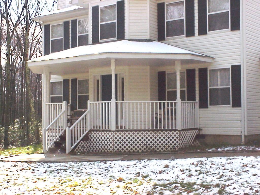 522 Devils Hole Road Cresco, PA 18326 - Photo 5 of 6 a view of a brick house with many windows