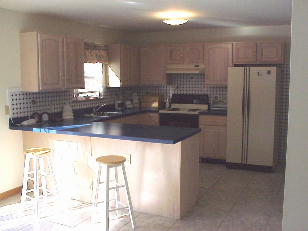 522 Devils Hole Road Cresco, PA 18326 - Photo 6 of 6 a kitchen with kitchen island granite countertop a sink cabinets and stainless steel appliances