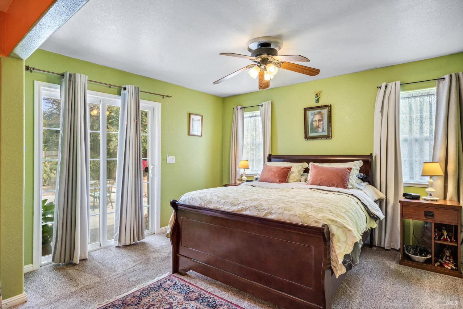 971 Eleanor Avenue Rohnert Park, CA 94928 - Photo 20 of 25 a bedroom with a bed and a chandelier