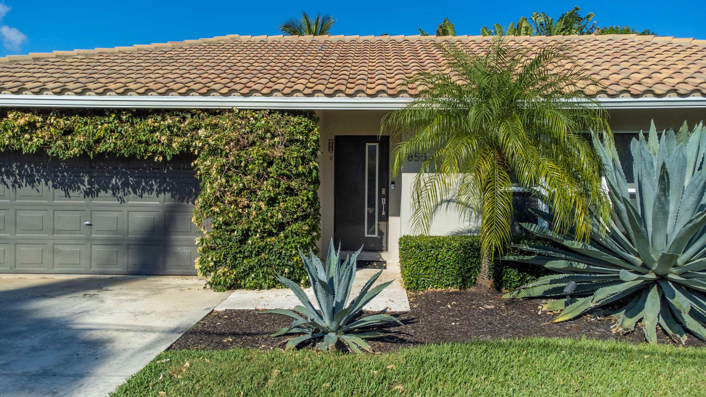 855 Berkley Street Boca Raton, FL 33487 - Photo 7 of 31 a view of a house with a tree