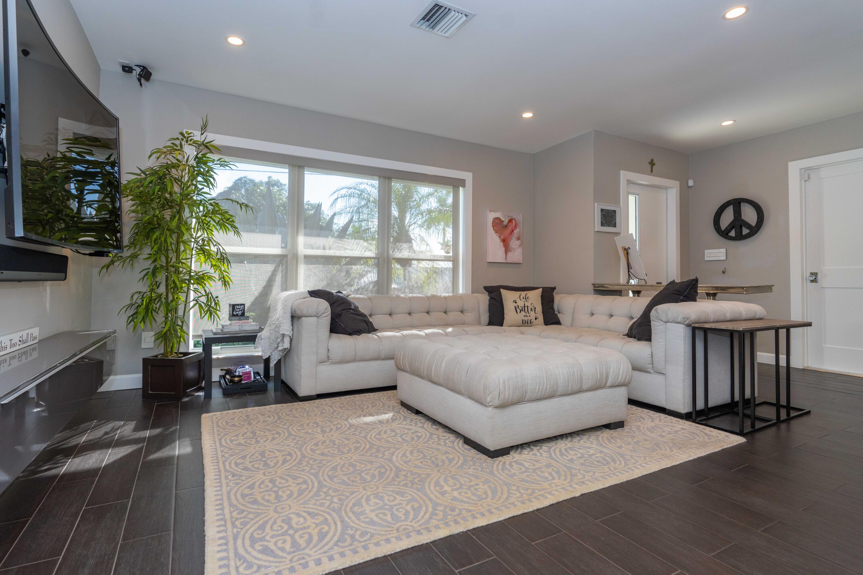 855 Berkley Street Boca Raton, FL 33487 - Photo 8 of 31 a living room with furniture potted plant and a large window
