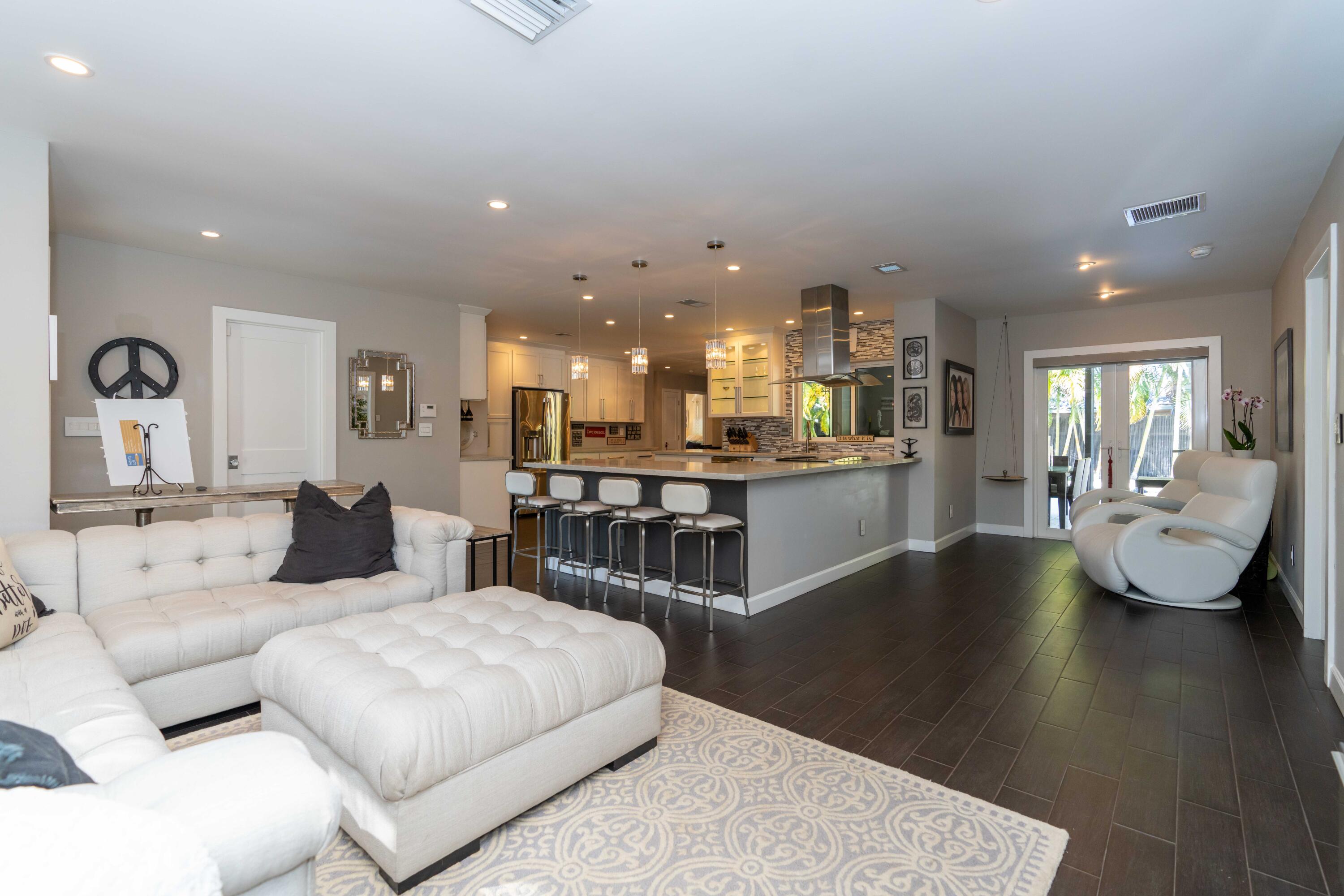 855 Berkley Street Boca Raton, FL 33487 - Photo 9 of 31 a living room with fireplace furniture and a wooden floor