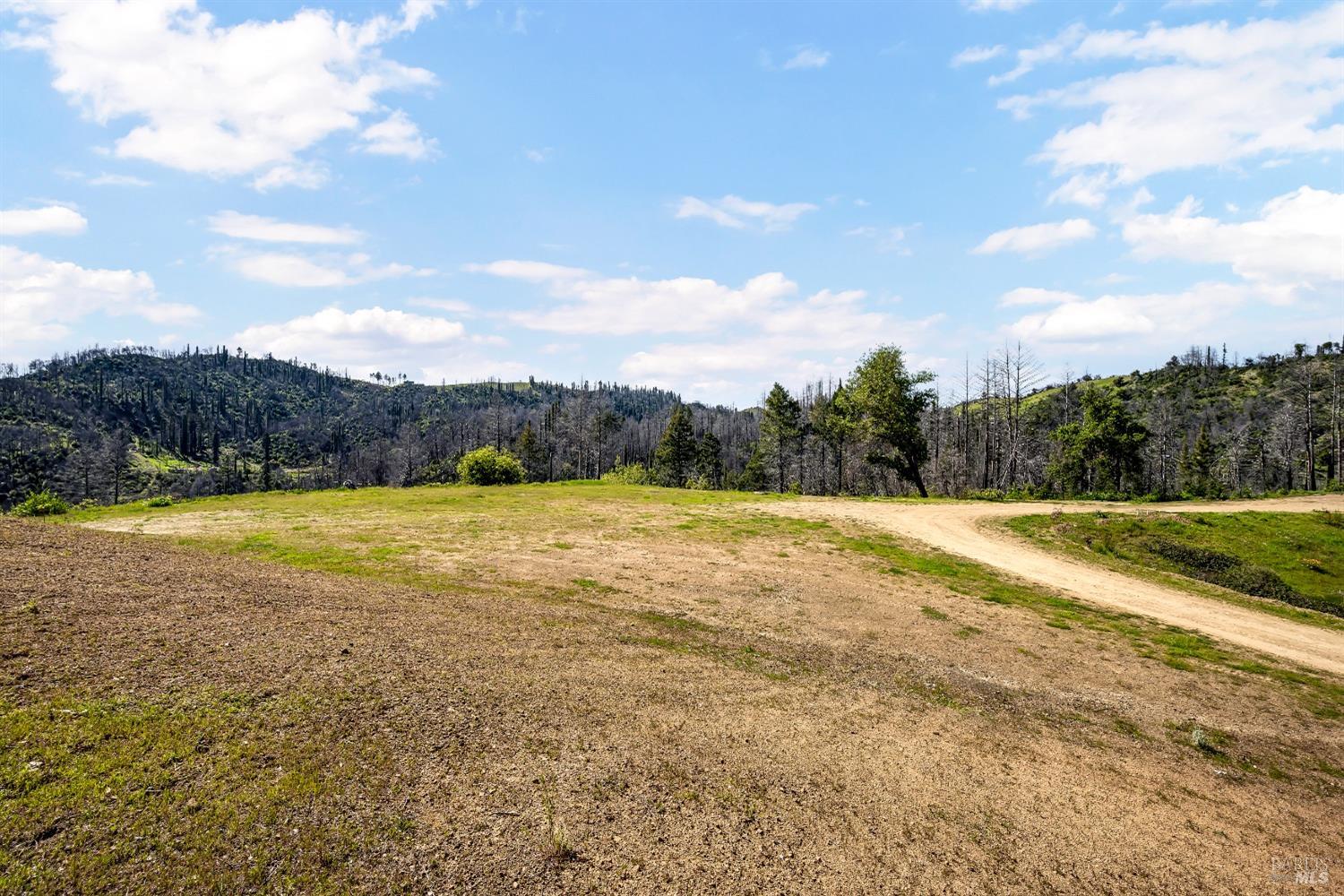 7777 Mill Creek Road Healdsburg, CA 95448 - Photo 2 of 18 a view of an outdoor space and a yard
