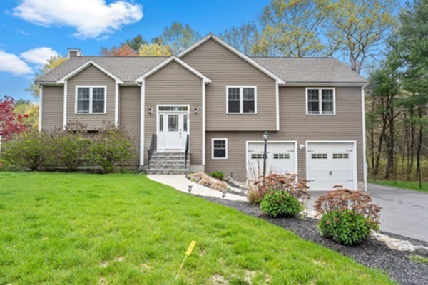 980 North Main Street Raynham, MA 02767 - Photo 1 of 29 a front view of a house with a yard and trees
