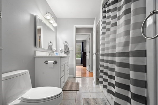 980 North Main Street Raynham, MA 02767 - Photo 11 of 29 a bathroom with a toilet and a shower