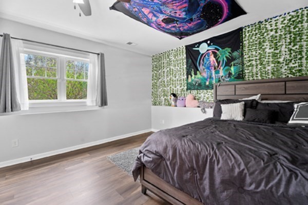 980 North Main Street Raynham, MA 02767 - Photo 14 of 29 a bed sitting in a bedroom next to a window