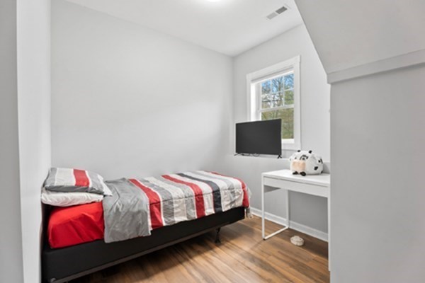 980 North Main Street Raynham, MA 02767 - Photo 18 of 29 a bedroom with a bed and a window