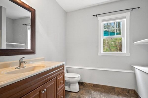 980 North Main Street Raynham, MA 02767 - Photo 20 of 29 a bathroom with a sink a toilet and a window