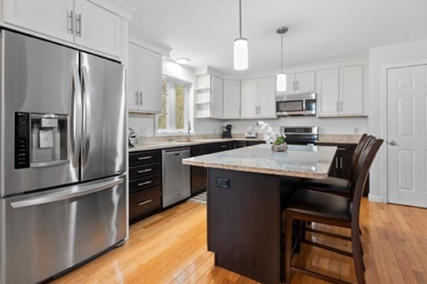 980 North Main Street Raynham, MA 02767 - Photo 2 of 29 a kitchen with stainless steel appliances a refrigerator a stove a sink and a refrigerator