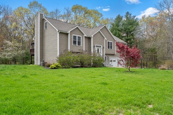 980 North Main Street Raynham, MA 02767 - Photo 27 of 29 a front view of a house with garden