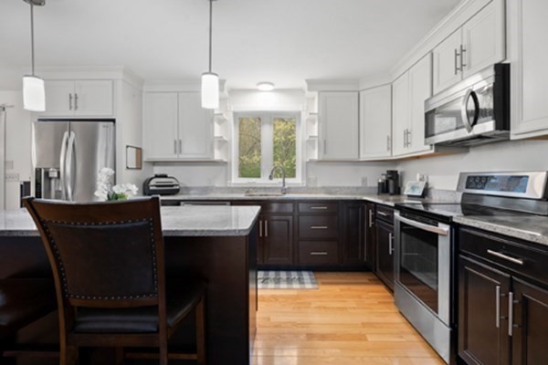 980 North Main Street Raynham, MA 02767 - Photo 3 of 29 a kitchen with stainless steel appliances granite countertop a stove top oven a refrigerator a sink and dishwasher