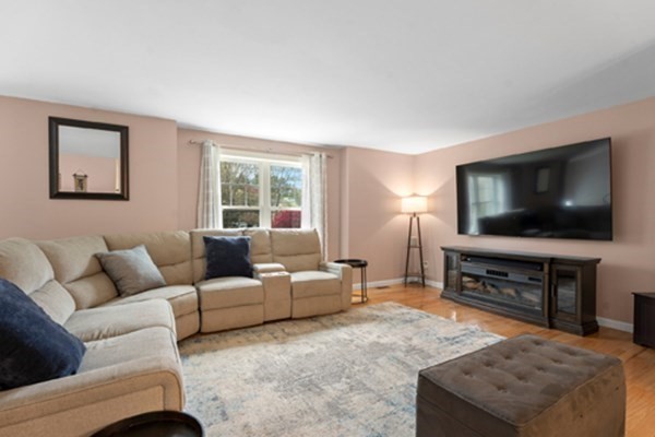 980 North Main Street Raynham, MA 02767 - Photo 7 of 29 a living room with furniture and a flat screen tv