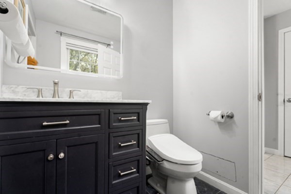 980 North Main Street Raynham, MA 02767 - Photo 10 of 29 a bathroom with a sink a toilet and a mirror
