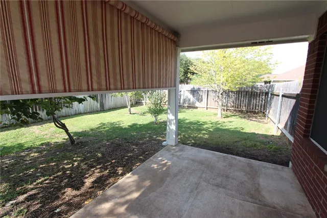 a view of a backyard with a small cabin