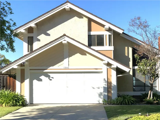 a house view with a outdoor space