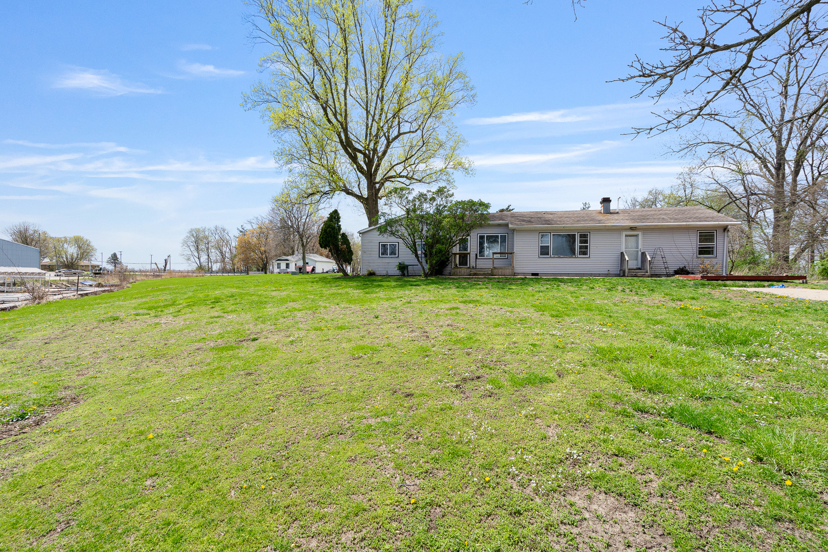 2697 River Road Kankakee, IL 60901 - Photo 23 of 60 a view of a tree in front of a building with a big yard