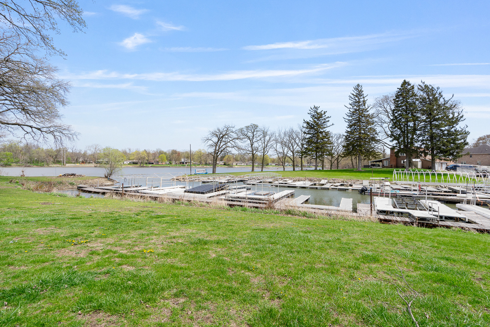 2697 River Road Kankakee, IL 60901 - Photo 3 of 60 a view of a swimming pool with lawn chairs and a big yard