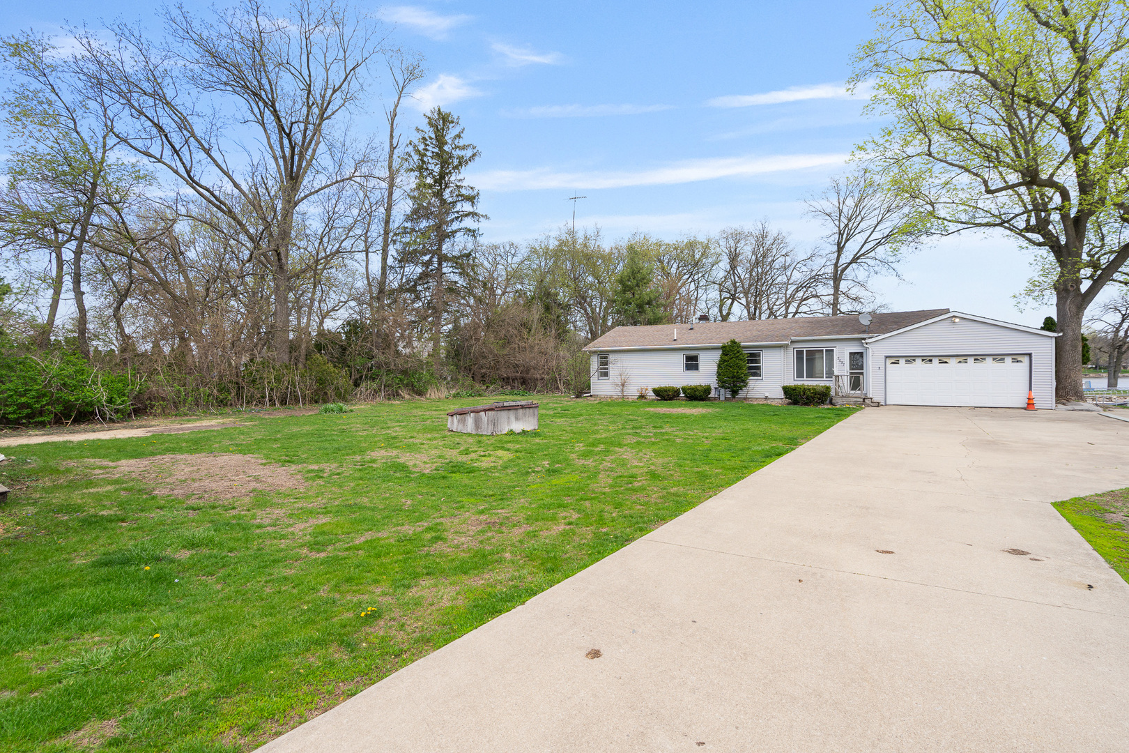 2697 River Road Kankakee, IL 60901 - Photo 33 of 60 a view of a white house next to a yard with big trees