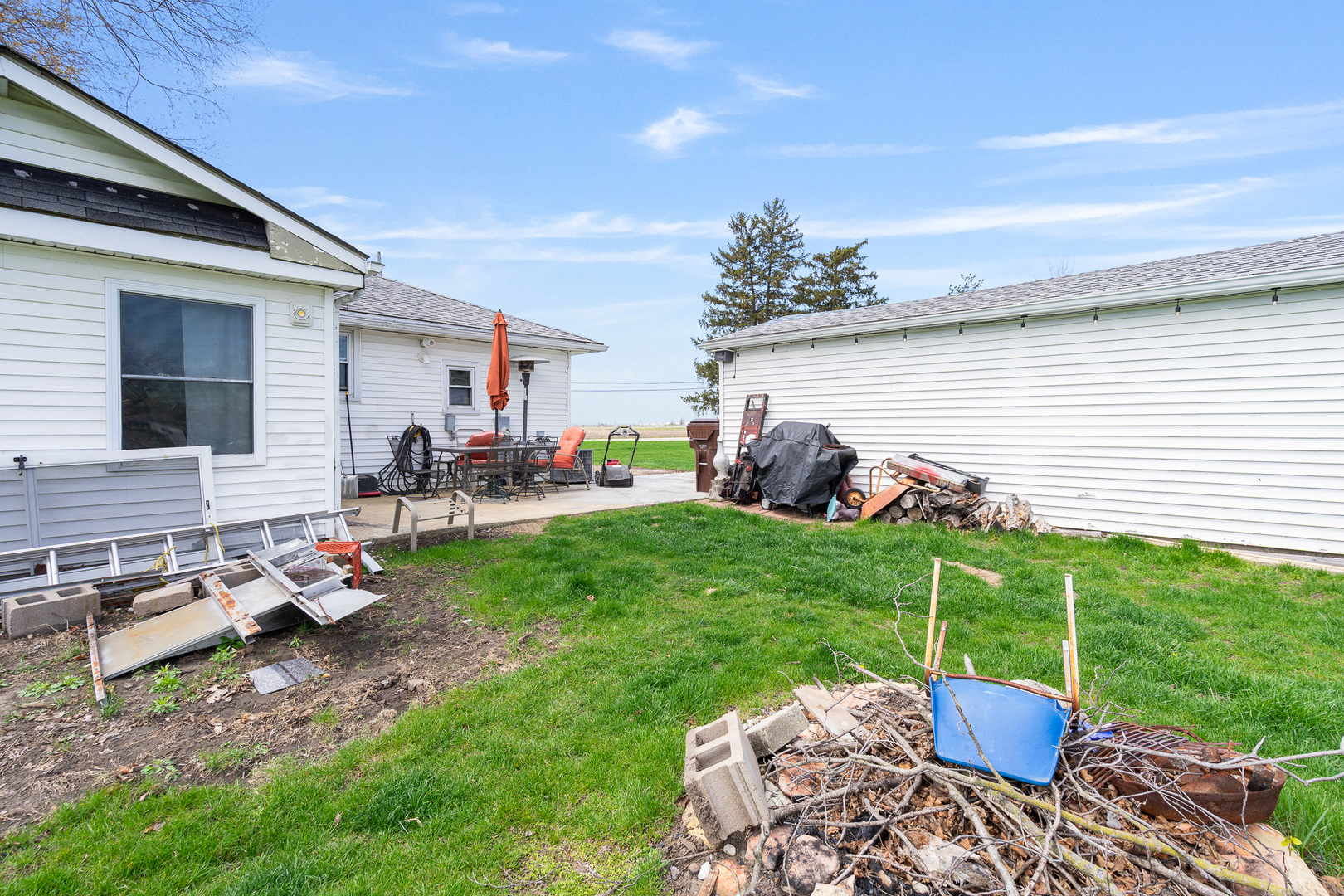 2697 River Road Kankakee, IL 60901 - Photo 49 of 60 a view of a backyard with furniture and a grill