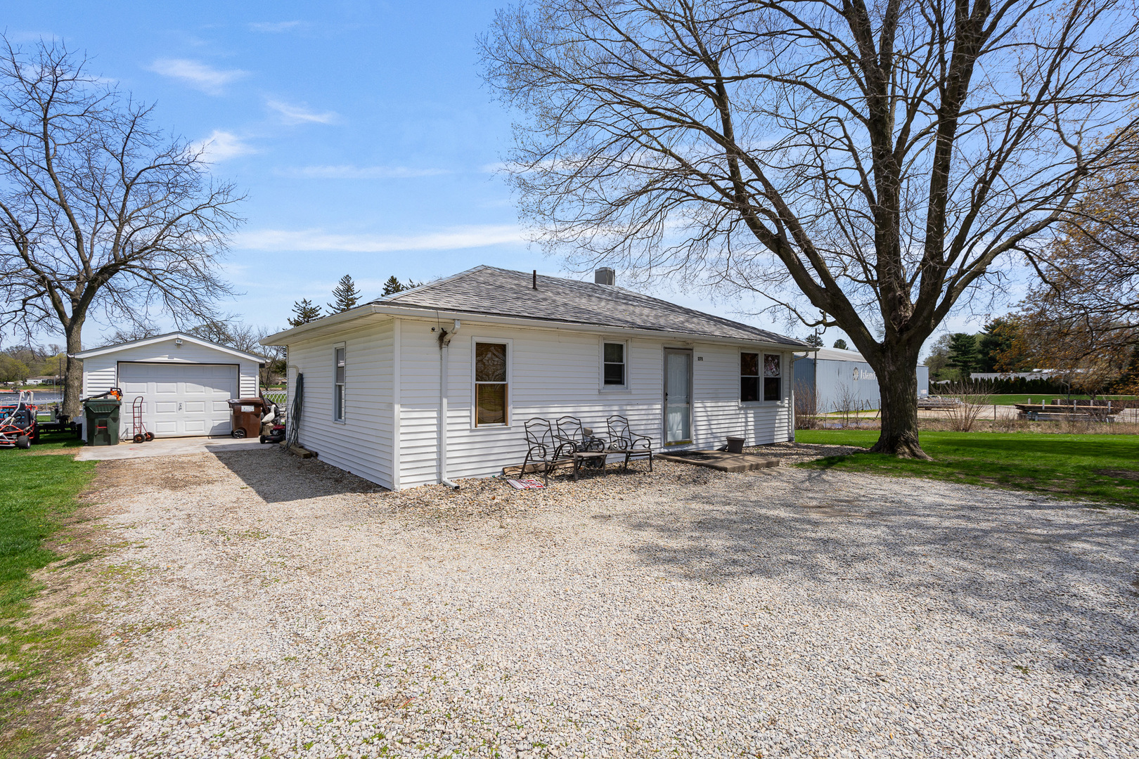 2697 River Road Kankakee, IL 60901 - Photo 52 of 60 a view of a house with a large tree and wooden fence