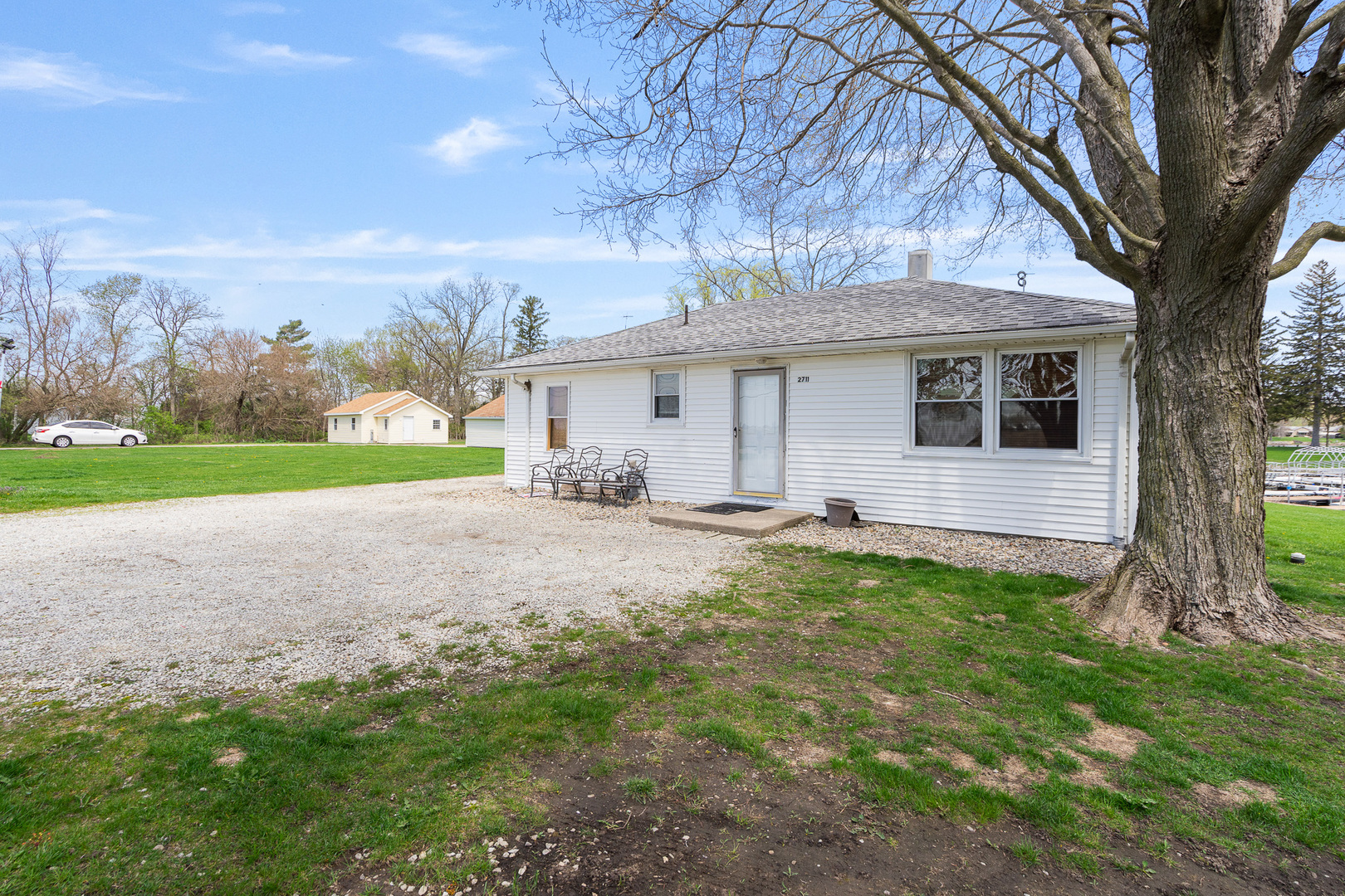 2697 River Road Kankakee, IL 60901 - Photo 55 of 60 a view of a house with backyard and a tree