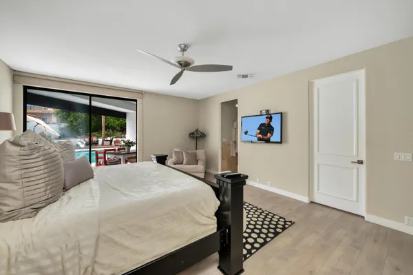 a bathroom with a sink mirror and a bathtub
