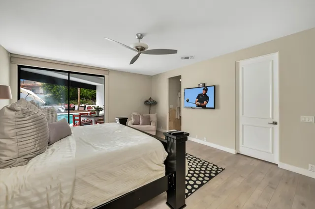 a bathroom with a sink mirror and a bathtub