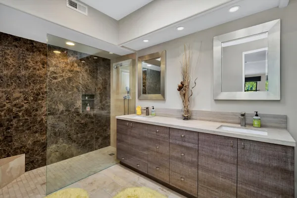 a bedroom with a large bed and a couch