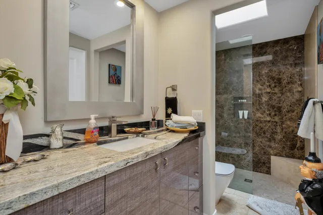 a kitchen with stainless steel appliances a refrigerator sink and cabinets