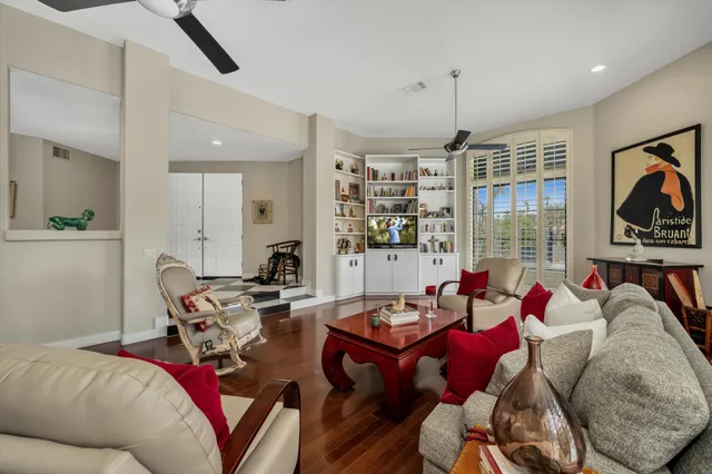 a living room with furniture fireplace and a flat screen tv