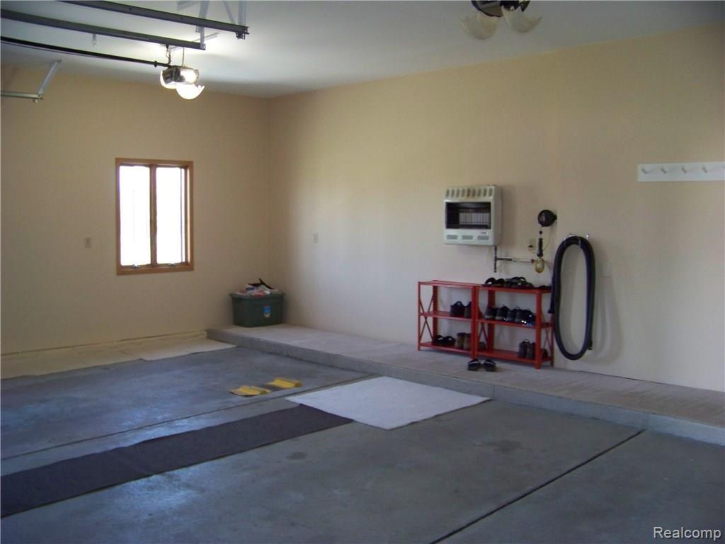 9967 Chinavare Road Newport, MI 48166 - Photo 33 of 45 Heated oversized garage.