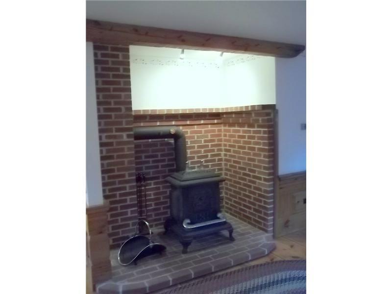 35 Maguire Road Kennebunk, ME 04043 - Photo 5 of 12 Living Room. Wood Stove in Living Room