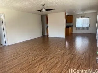 a view of a livingroom with wooden floor