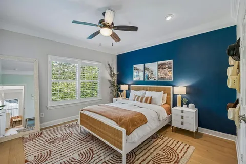 a bed room with a bed and a chandelier