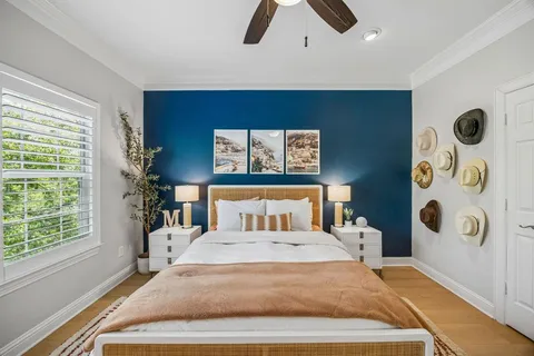 a bedroom with a large bed and a window