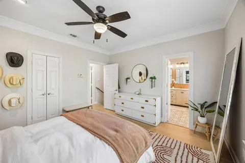 a bedroom with a bed and a dresser