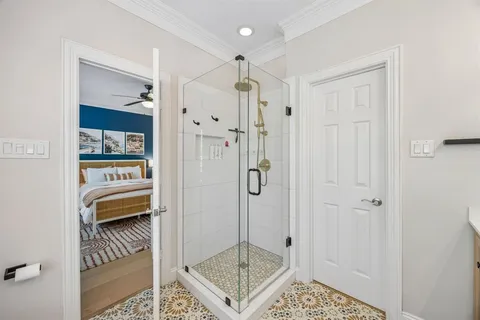 a bedroom with a bed couch and window