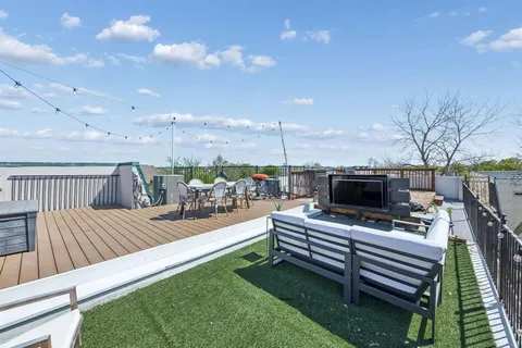 a view of a patio with a table and chairs