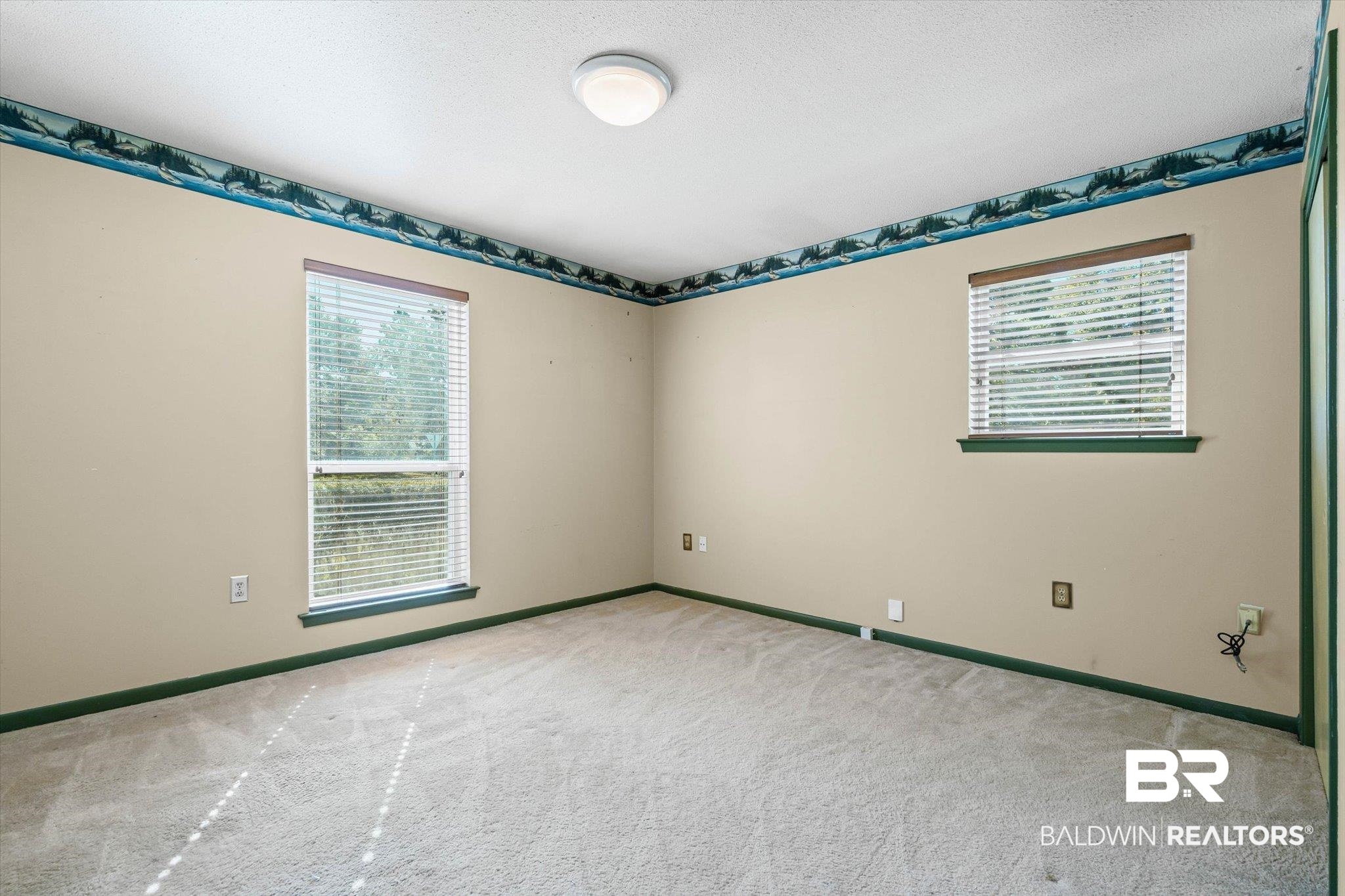 6300 Christopher Drive North Mobile, AL 36609 - Photo 13 of 22 Spare room featuring light carpet and a textured ceiling