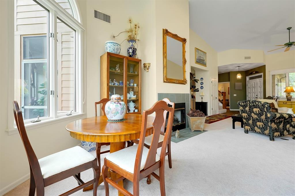 139 Woden Way Winter Haven, FL 33884 - Photo 13 of 60 a view of a dining room with furniture and chandelier